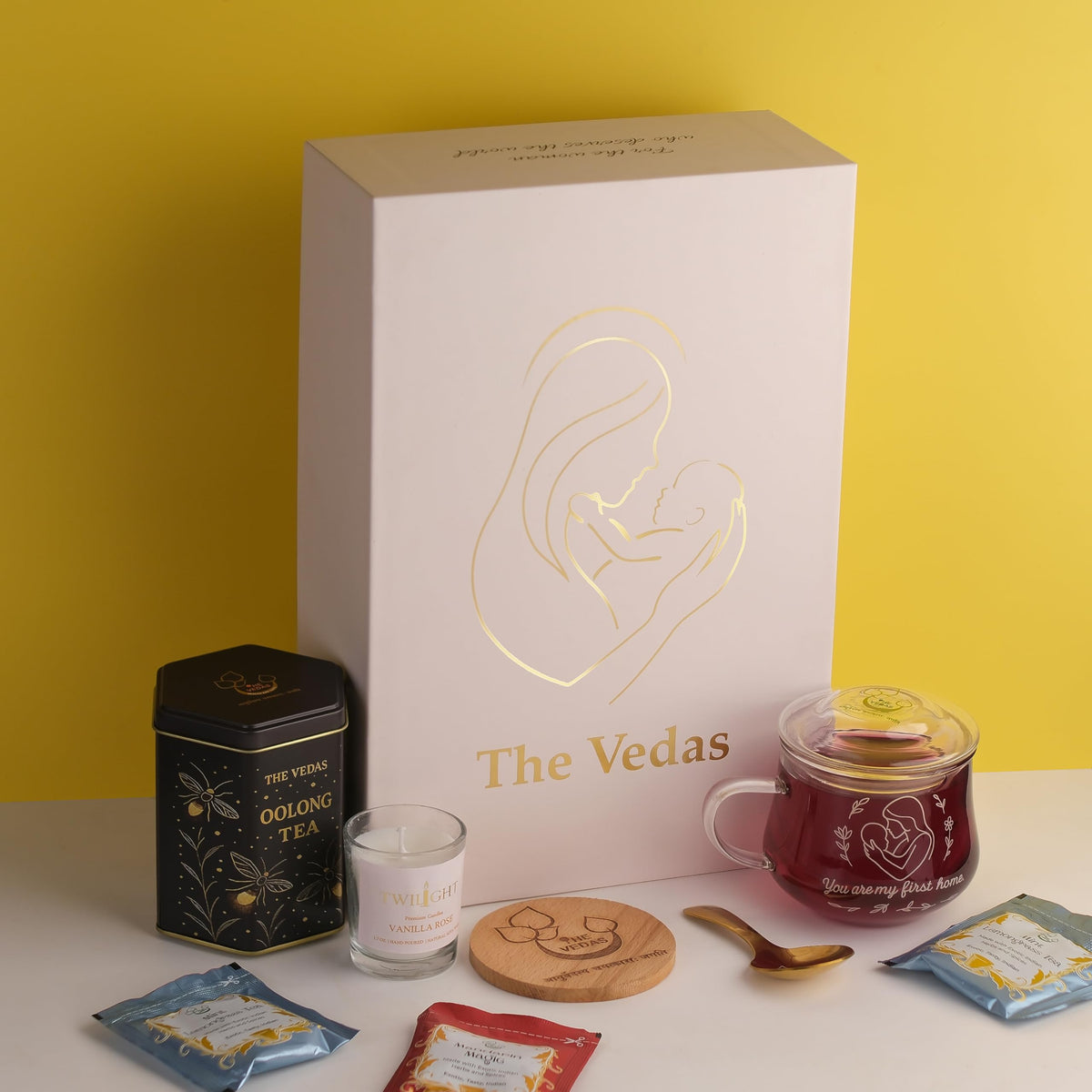 The Vedas Gift For MOM | Mothers day gift | 22 items teagift | 8 Different Flavours teabags | 1 Luxury Oolong tea tin Caddy | total 56 Cups of tea | 1 Glass Mug for MOM With lid and Infuser | 1 Scented Candle | 1 Branded Spoon | 1 Wooden Coaster