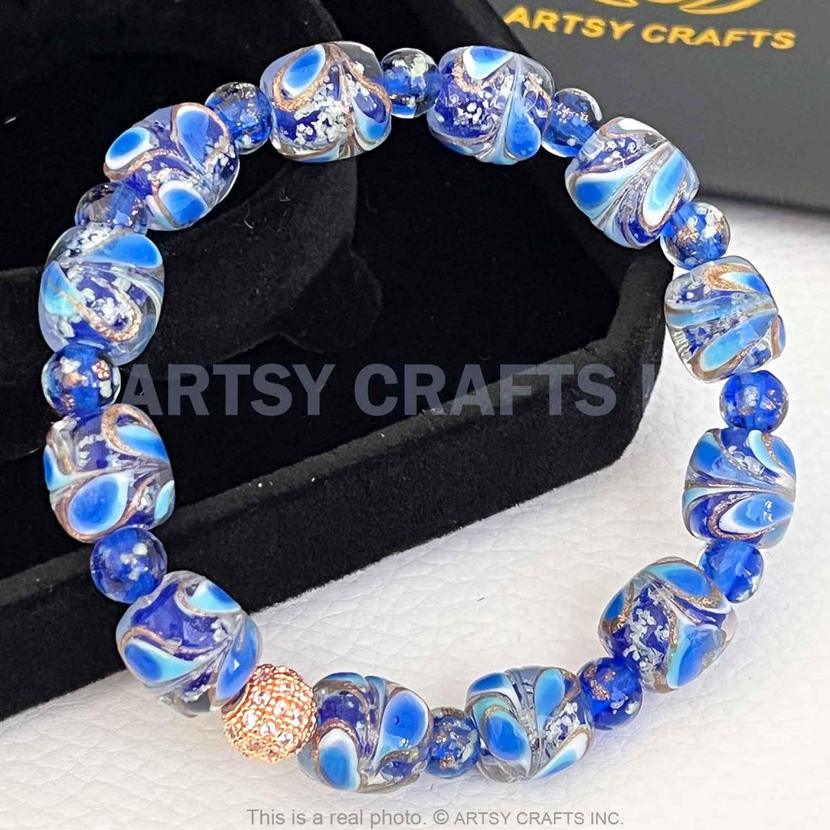 ARTSY CRAFTS INC Peacock Feather Glow in the Dark Firefly Bead Bracelet, Luminous Murano Jewelry Glowing Beaded Bracelet, Stretchy Wristband, Sapphire 6-7"