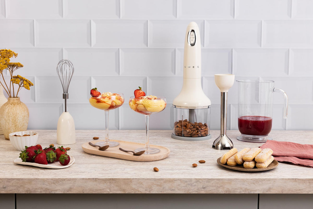 SMEG Handheld Immersion Blender with Beaker, Chopping Bowl w/Lid, Wire Whisk, 5 Speed Controls, made with Stainless Steel Blades and Ergonomic Design (Cream)