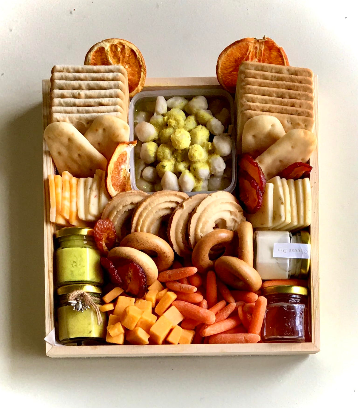 Vegetarian Charcuterie Board Fully Assorted with crackers, naan, cheddar cheese, and dips (Large Board 18x14)