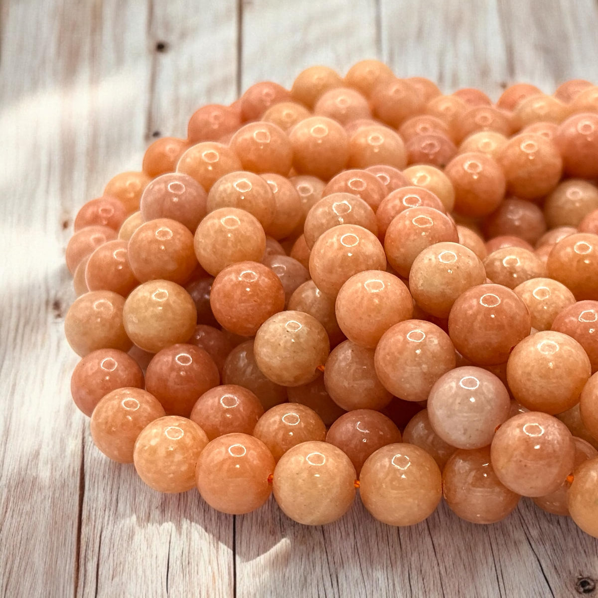 ABCGEMS Peruvian Strawberry Calcite Beads AKA Orchid Calcite (Well-Defined Peach & Orange Hues - Consistent Color with Minimal Fading or Dull Areas) Smooth Round 10mm