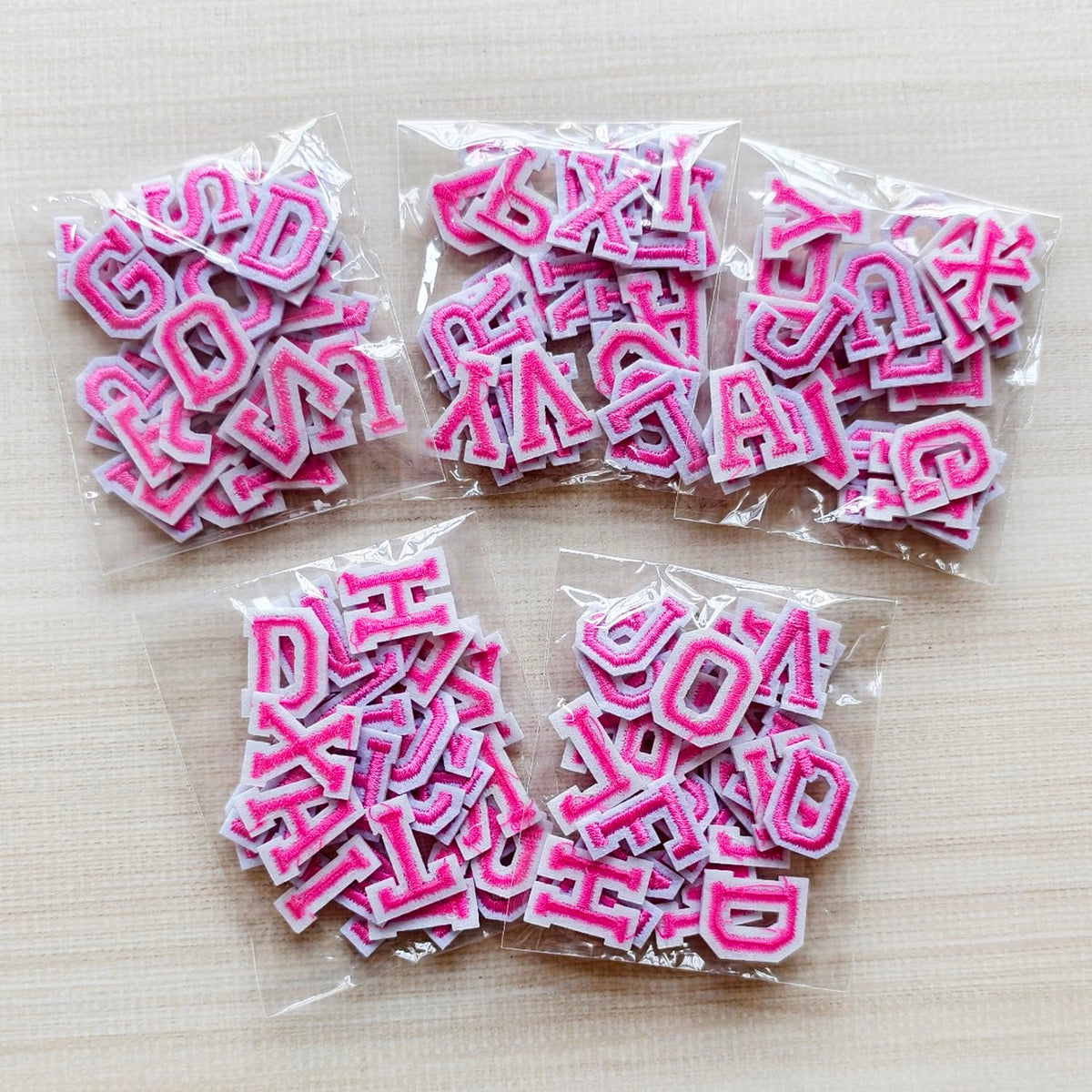 Zlettery 130pcs Iron on Letter Patches 0.7 inch, 5 Sets of 26 Embroidered Alphabet A-Z Patches for Clothing Jackets Hats Backpacks Jeans Pink
